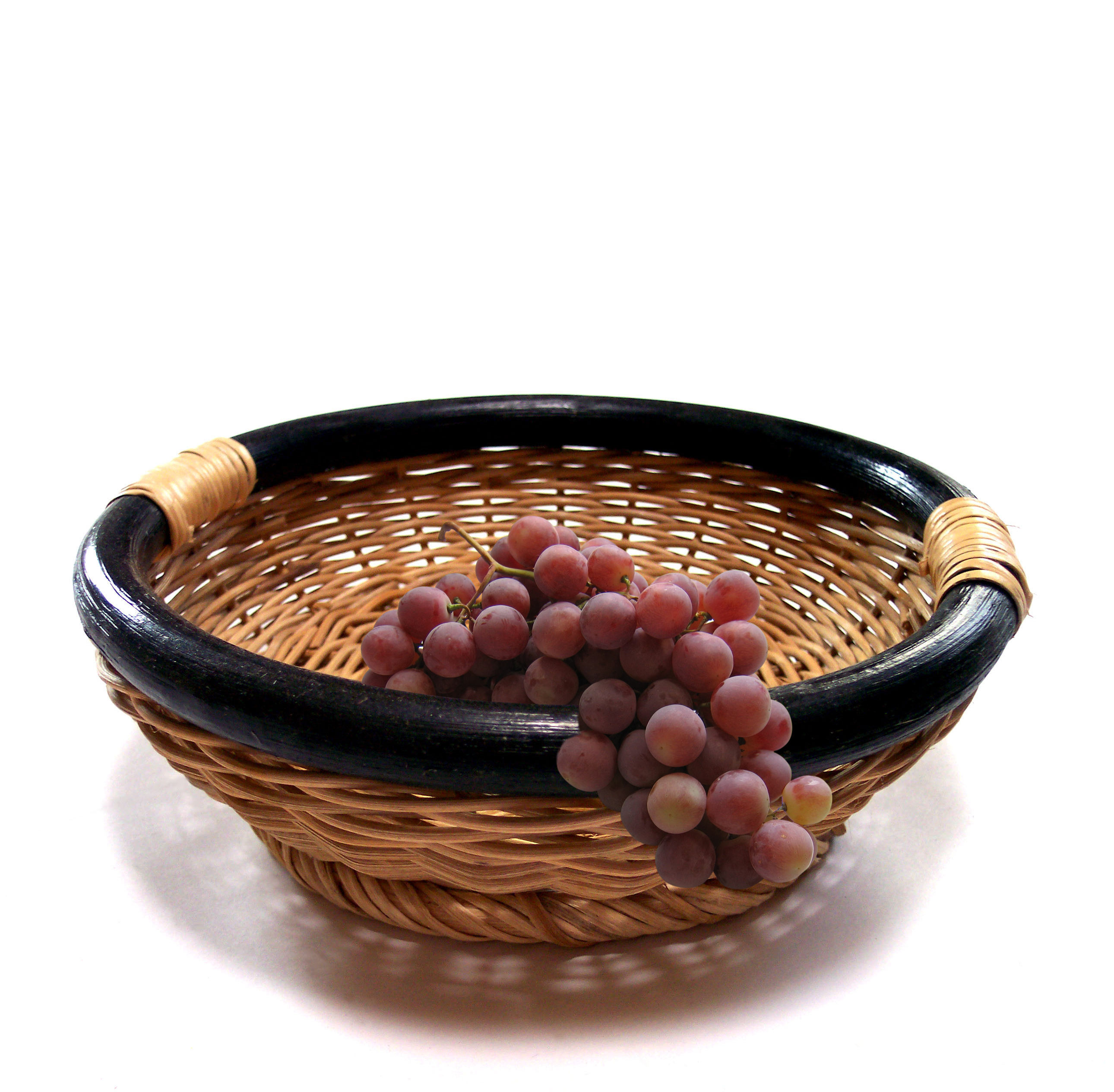 picture of bowl with grapes hanging